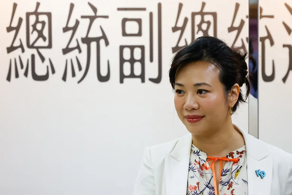 Taiwan People's Party (TPP) Cynthia Wu poses for photos after registering as vice president