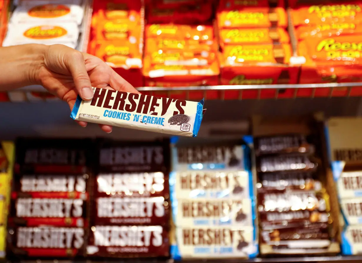 FILE PHOTO: An employee shows a Hershey's chocolate bar made in USA in the 
