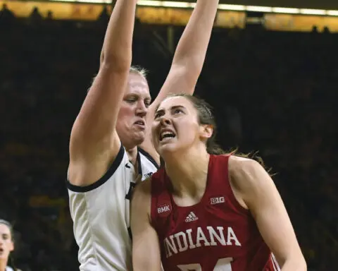 Caitlin Clark stars with 30 as No. 3 Iowa defeats No. 14 Indiana 84-57 before 13,000 despite snow