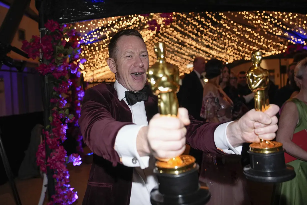 'Oppenheimer' crew keeps it low key, other winners revel at Vanity Fair's Oscar after-party