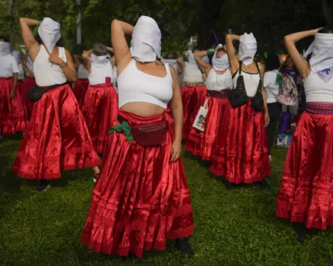 Facing historic shifts, Latin American women bathe streets in purple on International Women's Day