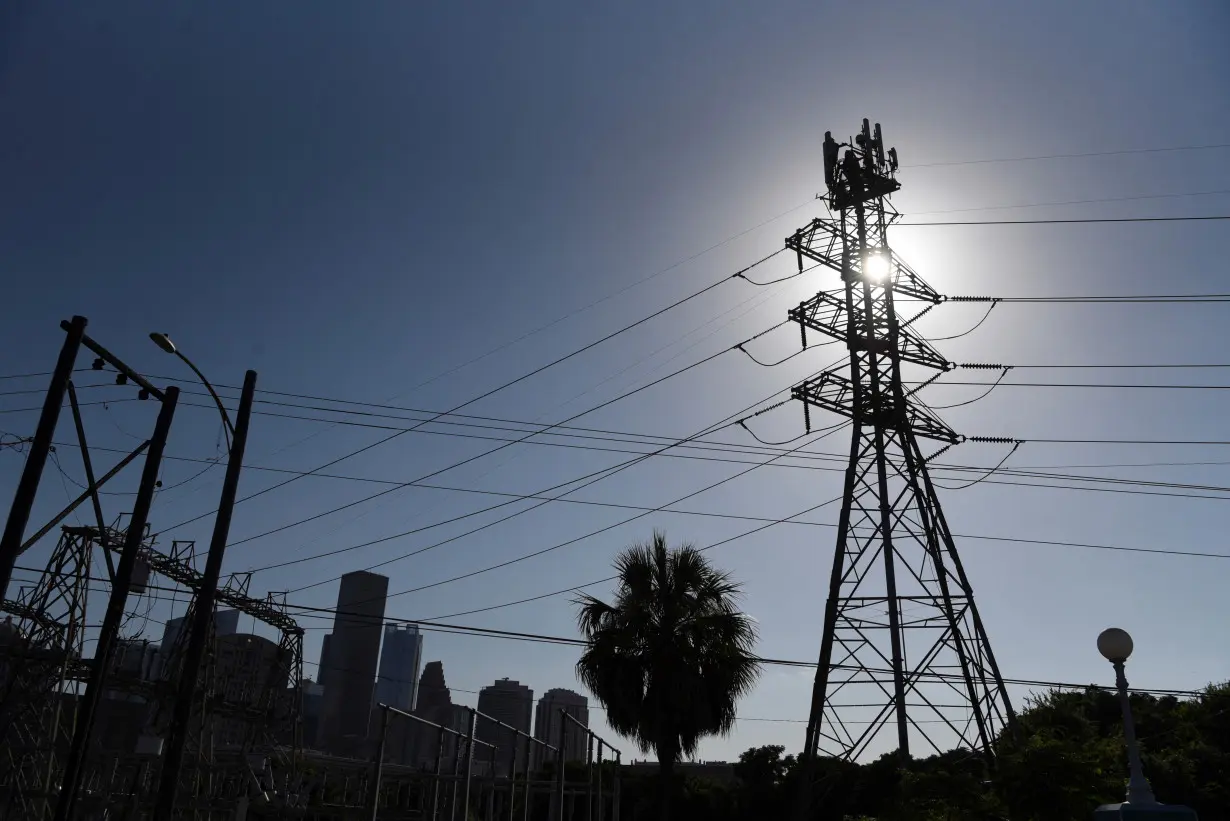 People react to a period of hot weather in Houston