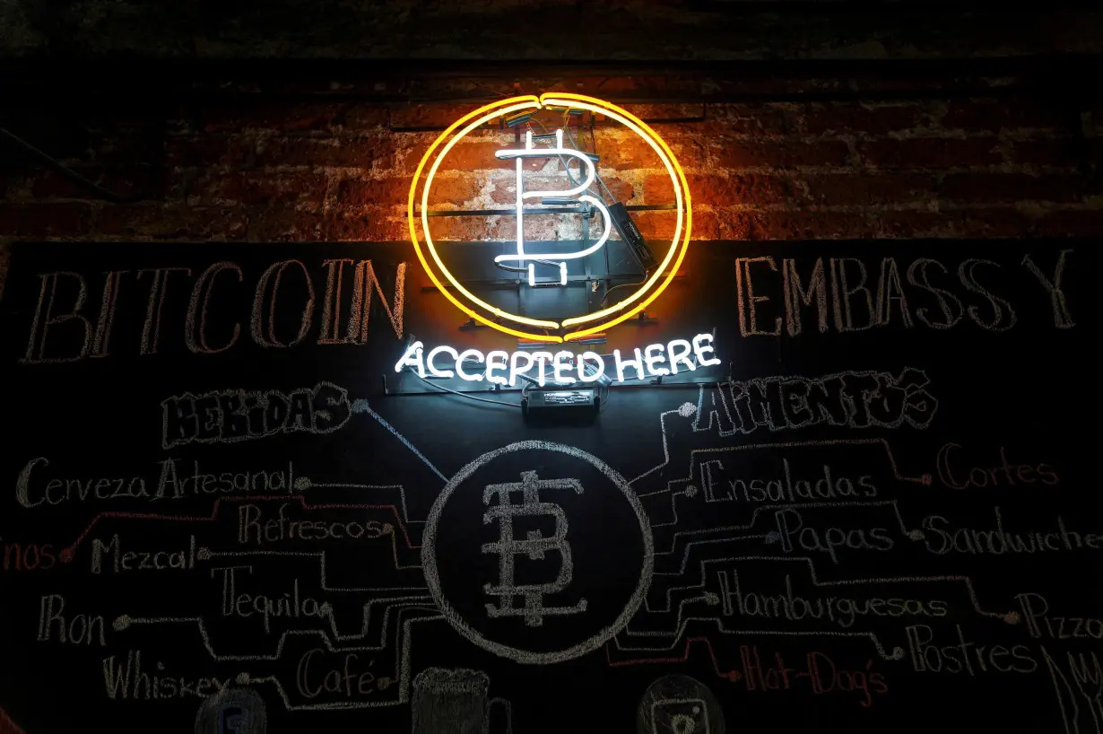 FILE PHOTO: A neon logo of virtual cryptocurrency Bitcoin is seen at the Bitcoin Embassy bar in this illustration