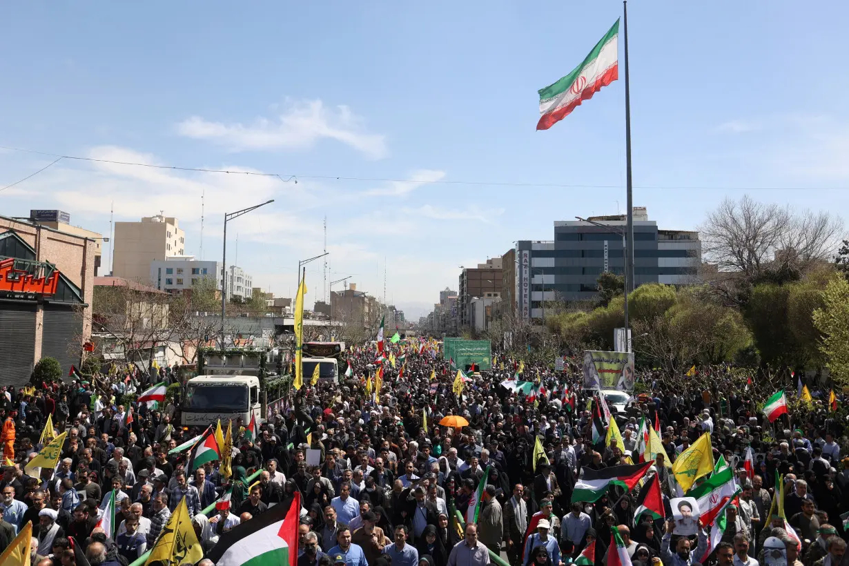 People gather for the funeral of members of the Islamic Revolutionary Guard Corps, in Tehran