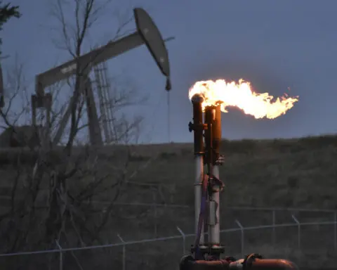 Heat-trapping carbon dioxide and methane levels in the air last year spiked to record highs again
