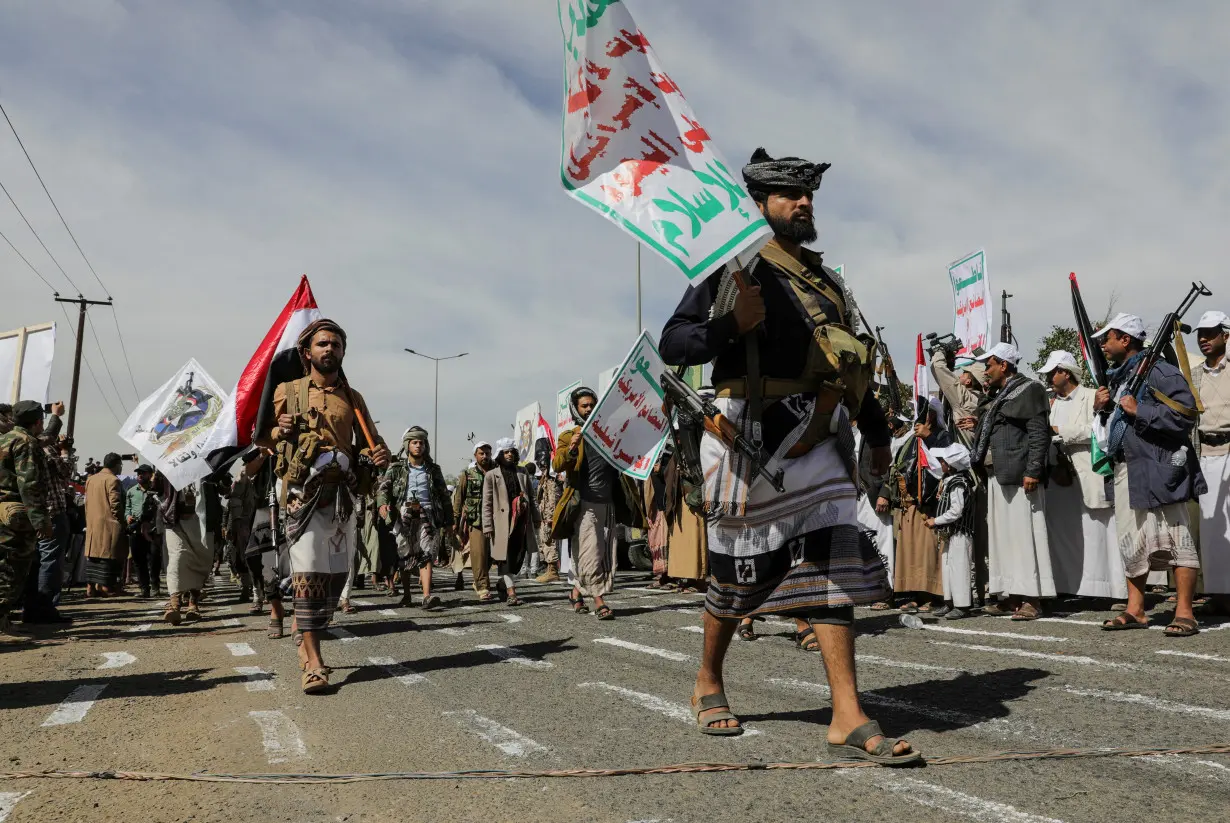 Houthi followers parade, in Sanaa