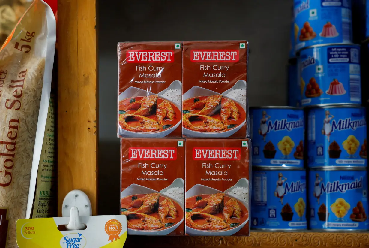 FILE PHOTO: Boxes of Everest fish curry masala are stacked on the shelf of a shop at a market in Srinagar