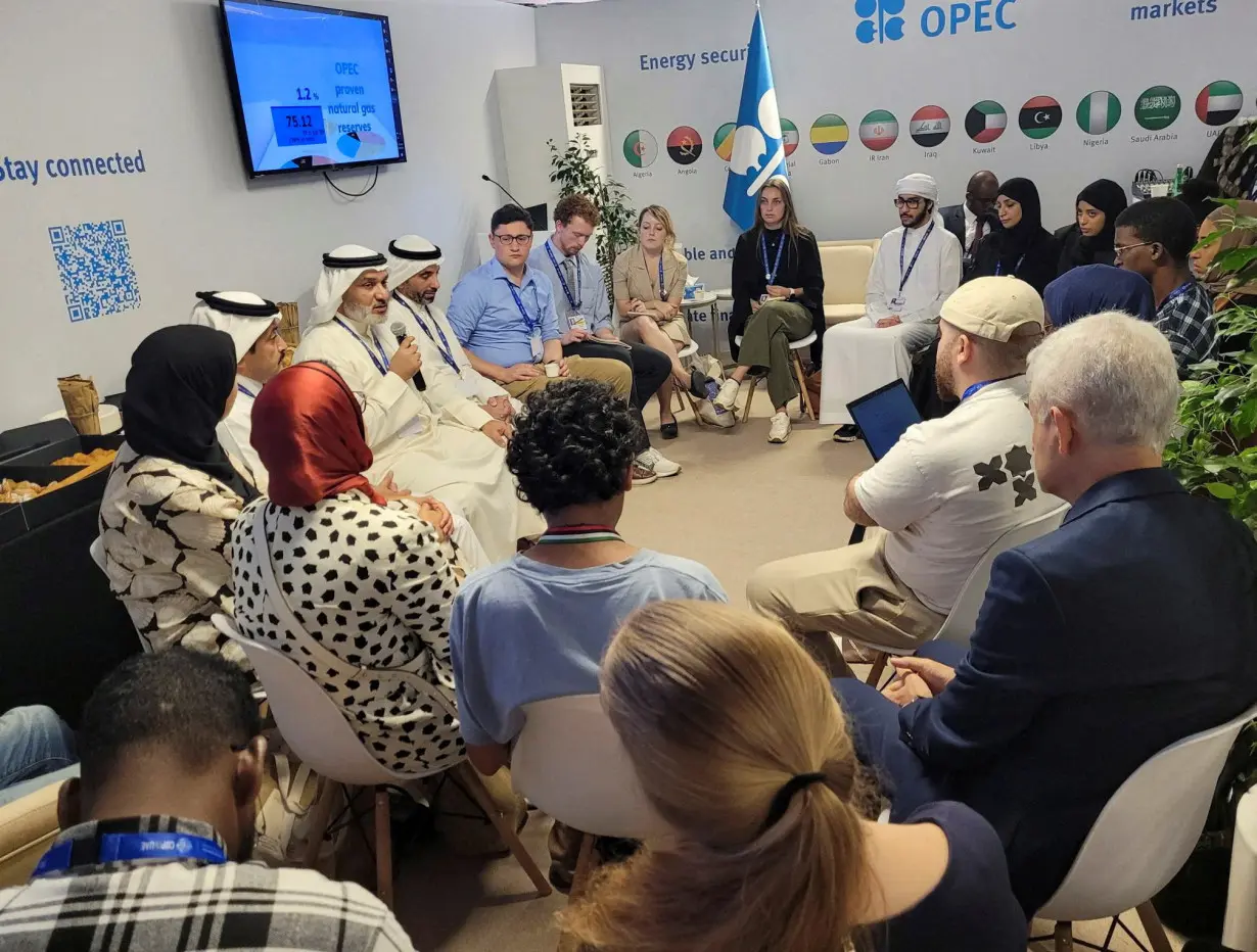 OPEC's Secretary General Haitham Al Ghais talks to youth during 