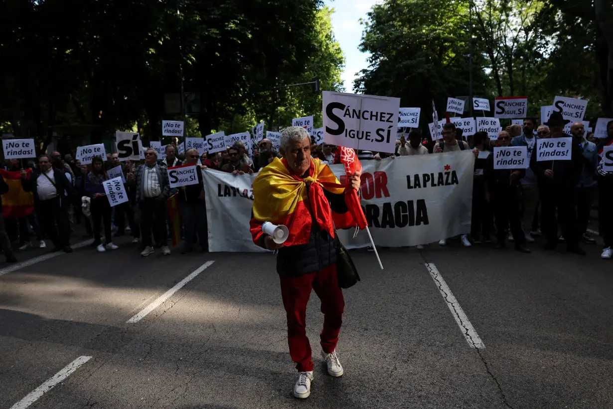 People march to show support for Spain's PM Sanchez, in Madrid