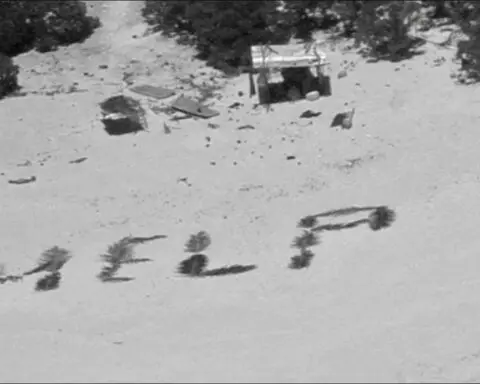 'HELP' sign on beach points rescuers to men stuck nine days on remote Pacific atoll