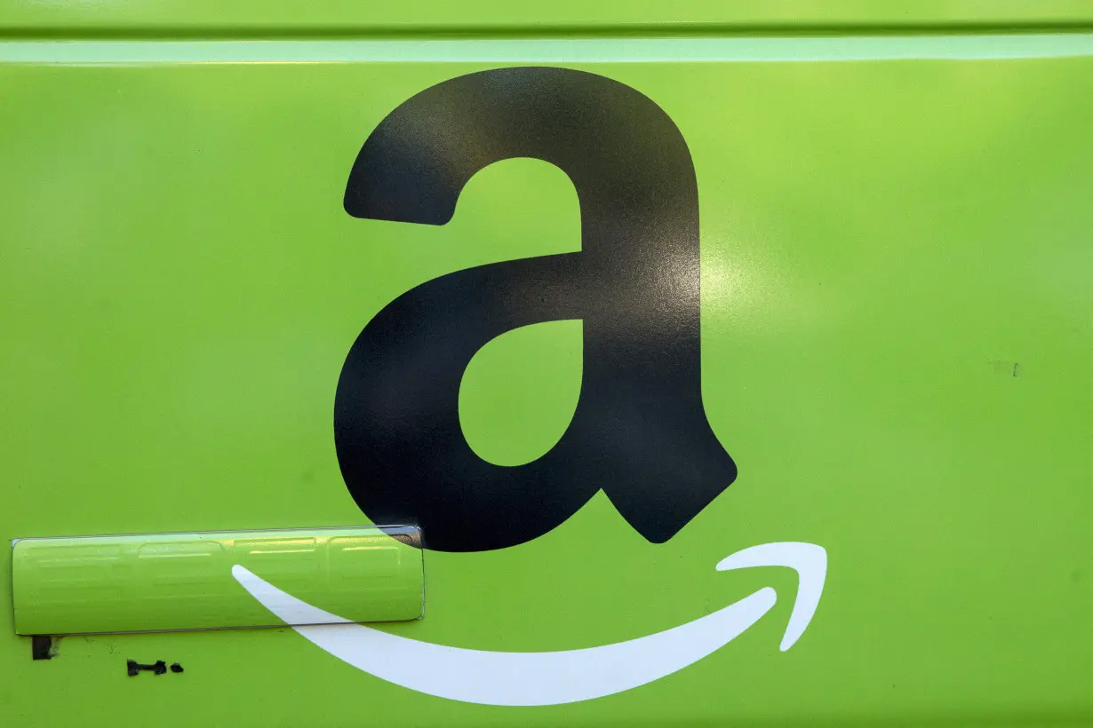 FILE PHOTO: The Amazon.com Inc. logo is seen on the side of a delivery truck in Brooklyn