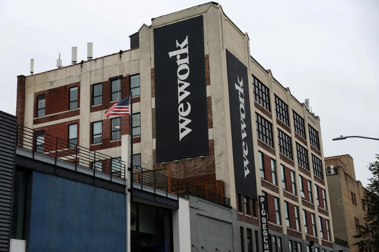 FILE PHOTO: A WeWork logo is seen outside its offices in the Queens borough of New York City