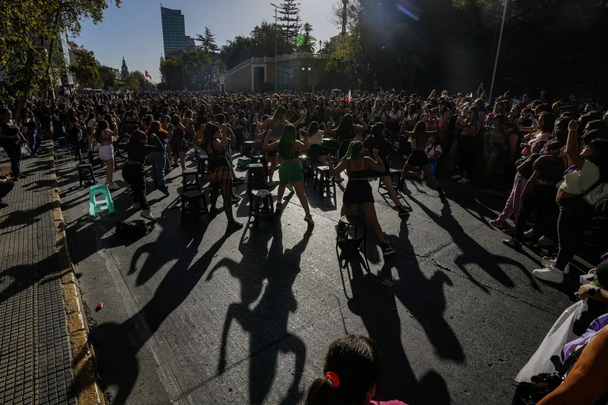 Facing historic shifts, Latin American women bathe streets in purple on International Women's Day