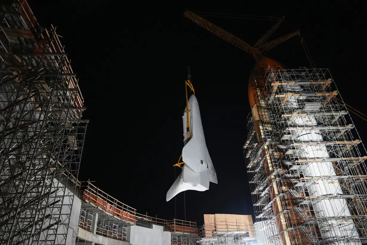 LA Post: Space Shuttle Endeavour hoisted for installation in vertical display at Los Angeles science museum