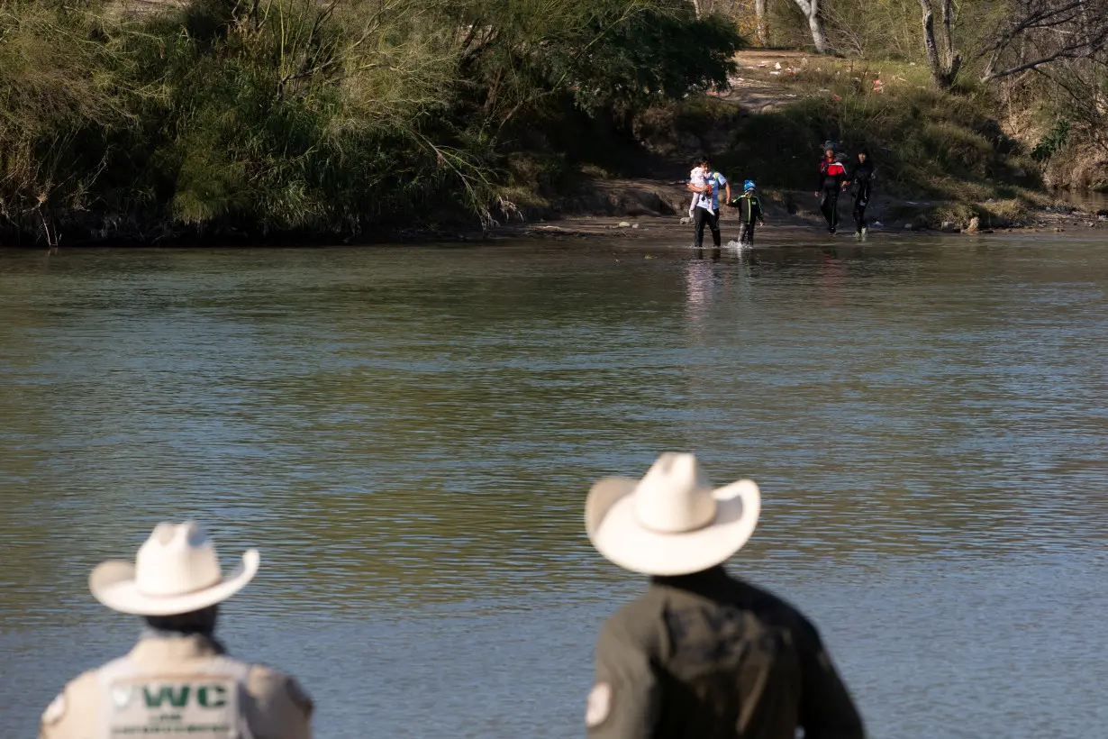 Republican legislators visit a border town where migrants are arriving from Mexico