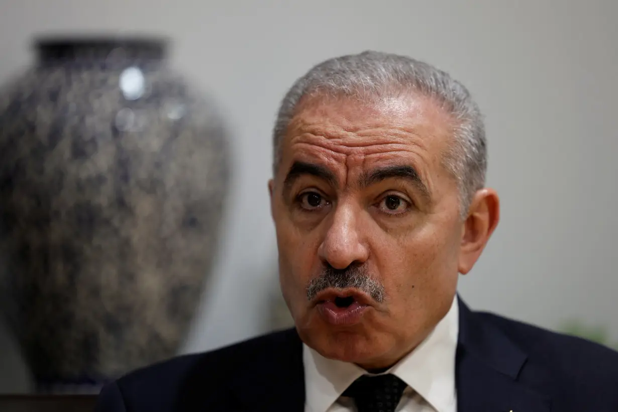 Palestinian Prime Minister Mohammad Shtayyeh speaks to Reuters at his office in Ramallah