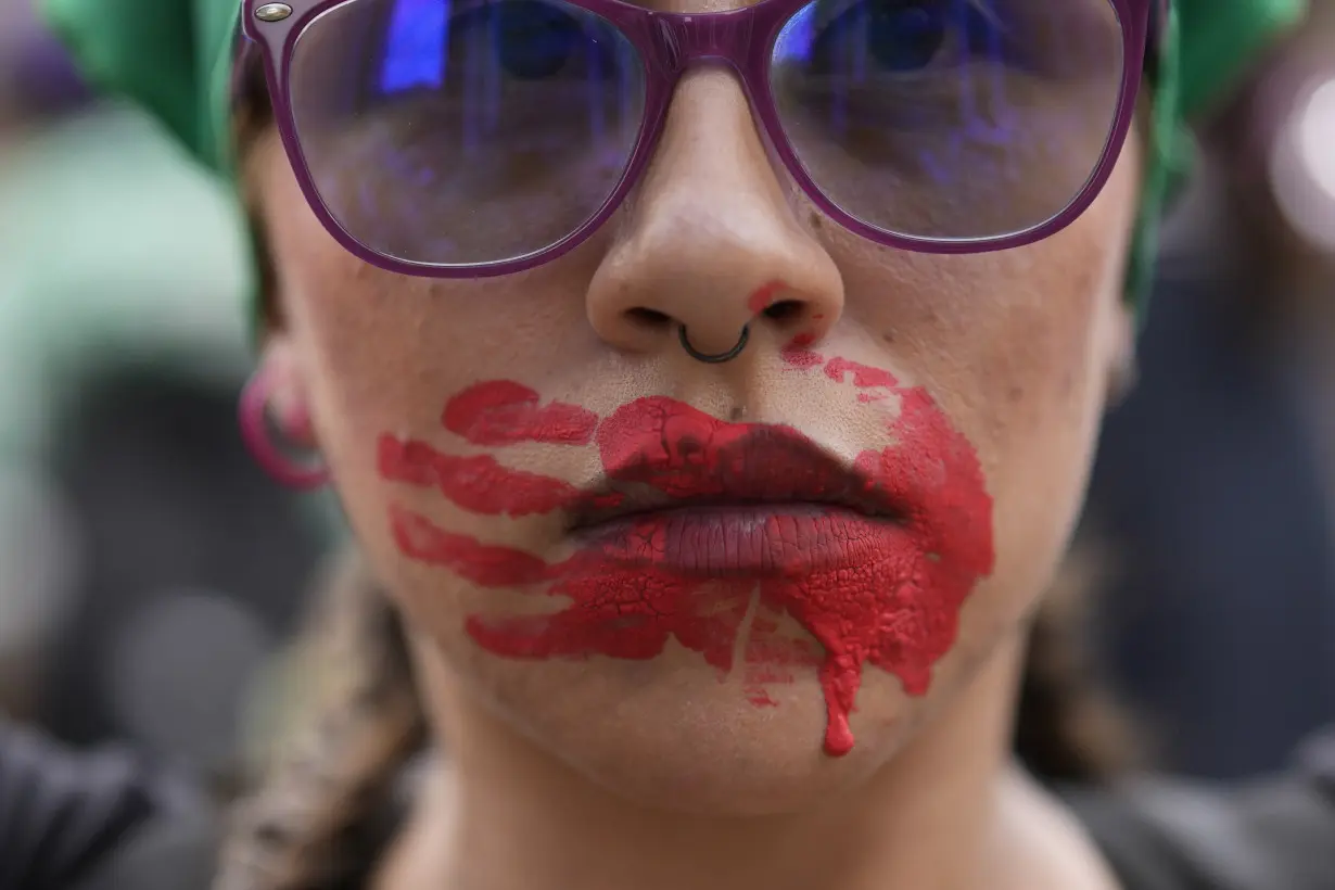 Facing historic shifts, Latin American women bathe streets in purple on International Women's Day