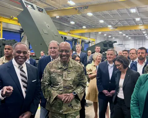 Top US military chief visits munitions plants with lawmakers to press the need to arm Ukraine