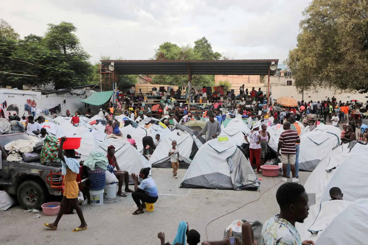 FILE PHOTO: Haitians fleeing gang violence find shelter in a sport arena, in Port-au-Prince