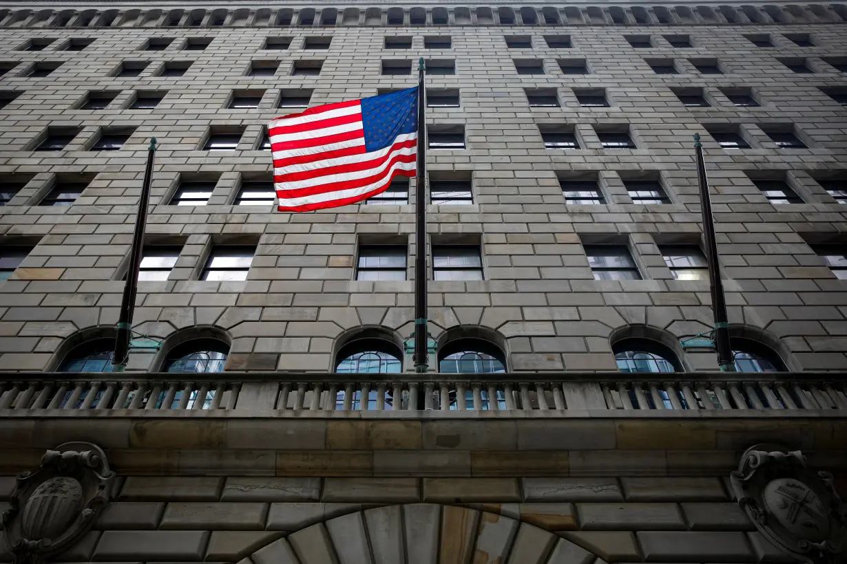 FILE PHOTO: The U.S. flag flies outside The Federal Reserve Bank of New York