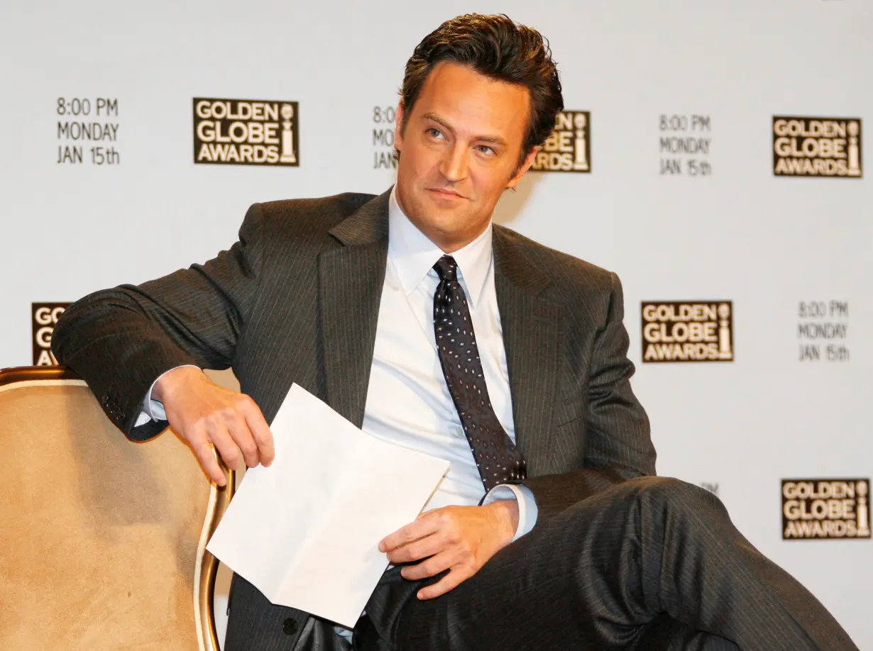 FILE PHOTO: Actor Matthew Perry waits to announce nominations at Golden Globes news conference in Beverly Hills