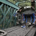 A train in central Buenos Aires strikes a boxcar on the track, injuring dozens