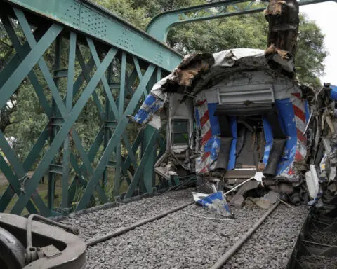 A train in central Buenos Aires strikes a boxcar on the track, injuring dozens