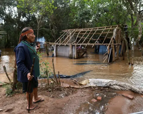 Indigenous Brazil community stays on flooded land in dispute with developer