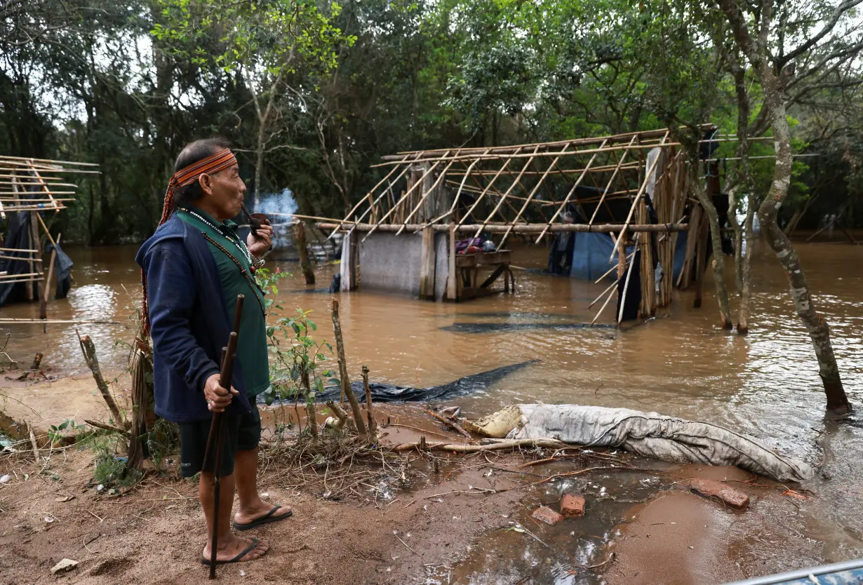 Indigenous Brazil community stays on flooded land in dispute with developer