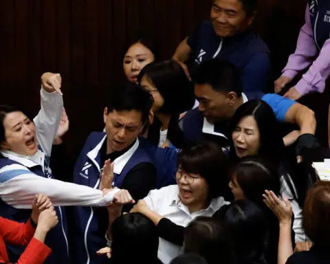 Taiwan lawmakers exchange blows in bitter dispute over parliament reforms