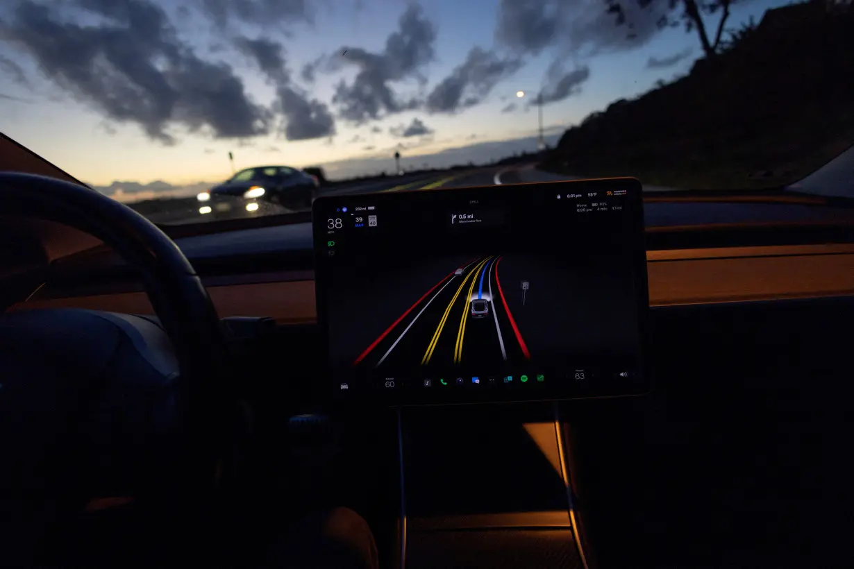 FILE PHOTO: Tesla Model 3 uses FSD beta to navigate city streets in California