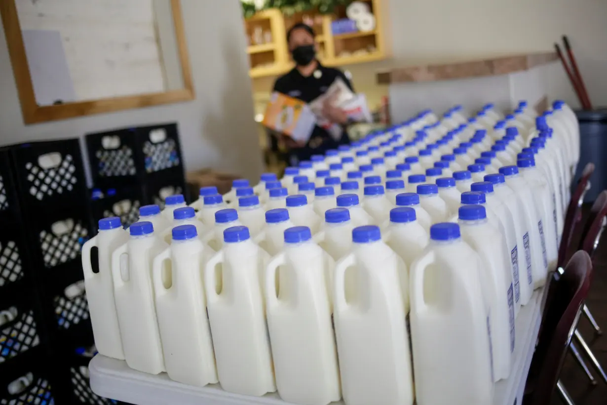 Plastic containers with milk are seen inside the El Elyon church which gives temporary shelter to asylum-seeker migrants, in El Paso