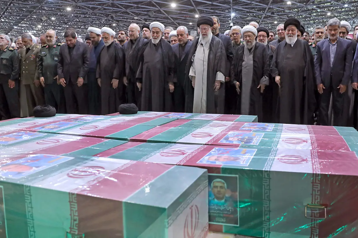 Iran's Supreme Leader Ayatollah Ali Khamenei performs prayer at a funeral for victims of helicopter crash, in Tehran