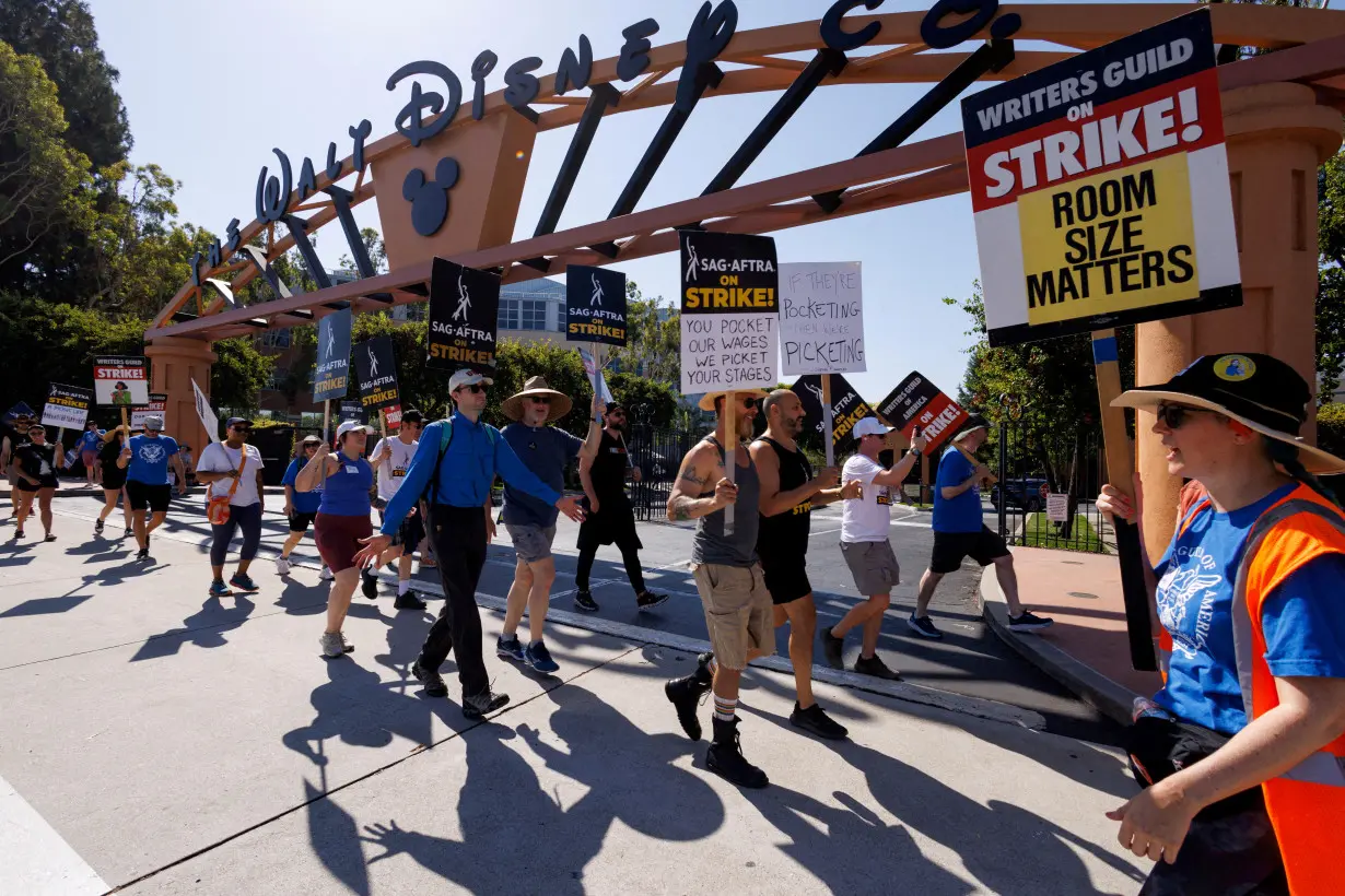 FILE PHOTO: Hollywood actors and writers on strike outside Disney studios in California