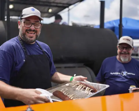 At the 'Super Bowl of Swine,' global barbecuing traditions are the wood-smoked flavor of the day