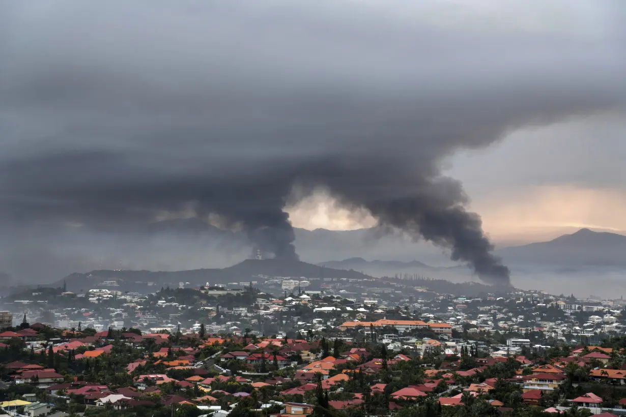 A police officer is held in deadly shooting in riot-hit New Caledonia after Macron pushes for calm