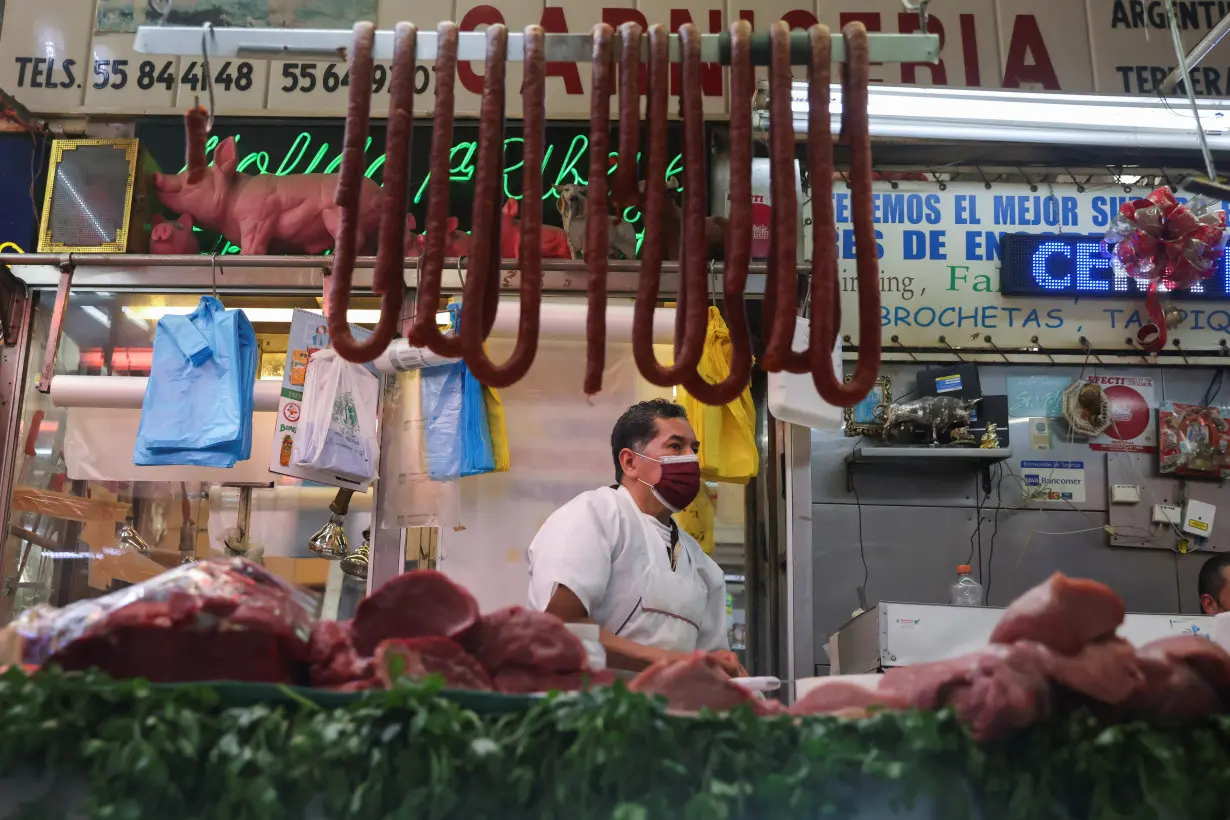 FILE PHOTO: A butcher sells meat at a market in Mexico City