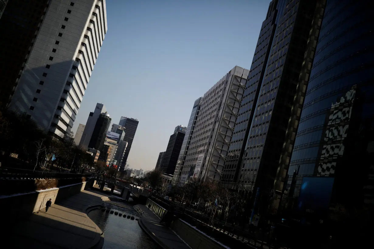 A man walks along the Cheonggye stream in central Seoul