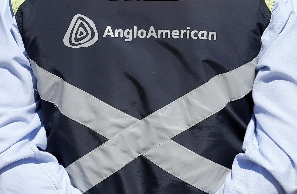 FILE PHOTO: Logo of Anglo American is seen on a jacket of an employee of the Los Bronces copper mine, in the outskirts of Santiago