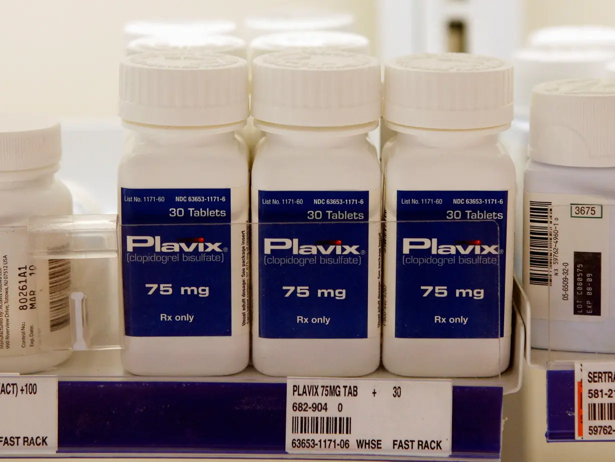 FILE PHOTO: Bottles of Plavix are displayed on the shelves at a pharmacy in North Aurora, Illinois.