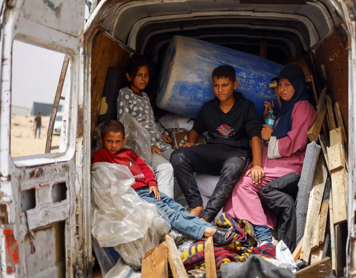 Palestinians flee Rafah following a nearby Israeli strike on an area designated for displaced