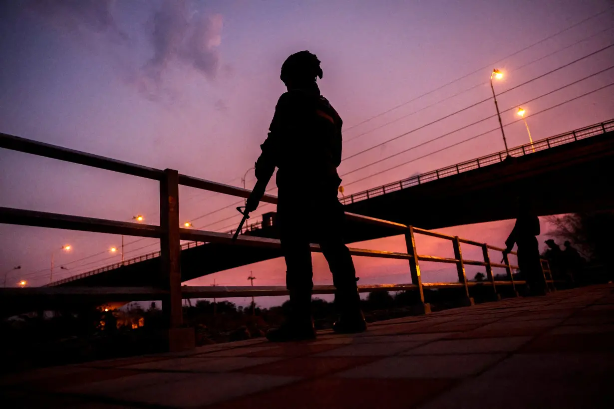 FILE PHOTO: Fall of Myanmar town to rebels sends people fleeing into Thailand