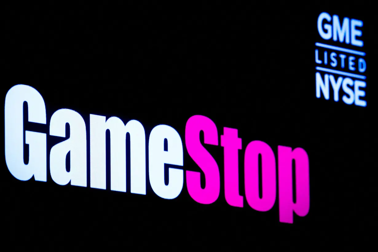 FILE PHOTO: A screen displays the logo and trading information for GameStop at the NYSE in New York