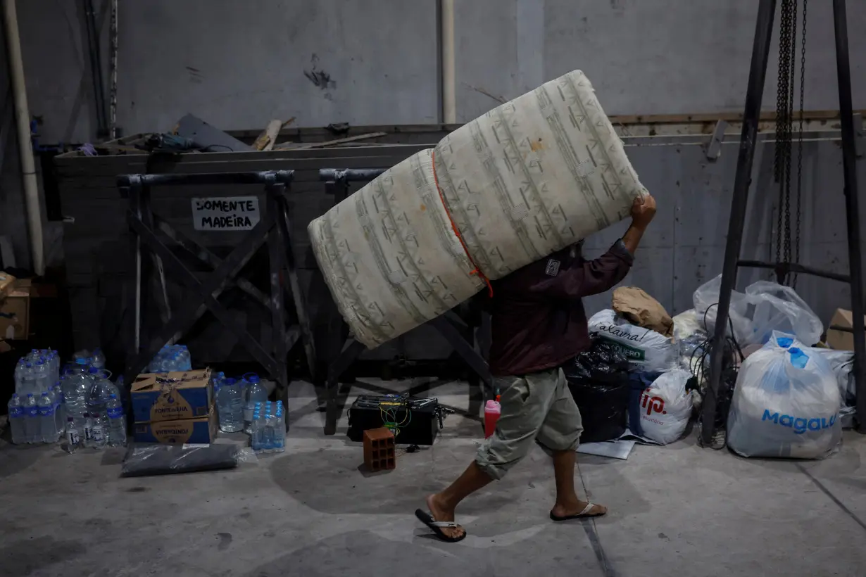 The Wider Image: Flood-battered farmers in southern Brazil wade through lost harvests