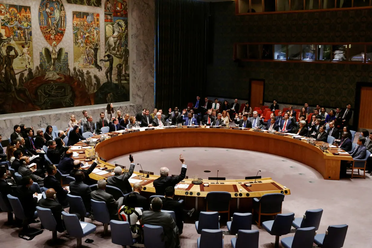 FILE PHOTO: Members of the United Nations Security Council vote to adopt a resolution on the Comprehensive Nuclear-Test-Ban Treaty at the United Nations Headquarters in New York