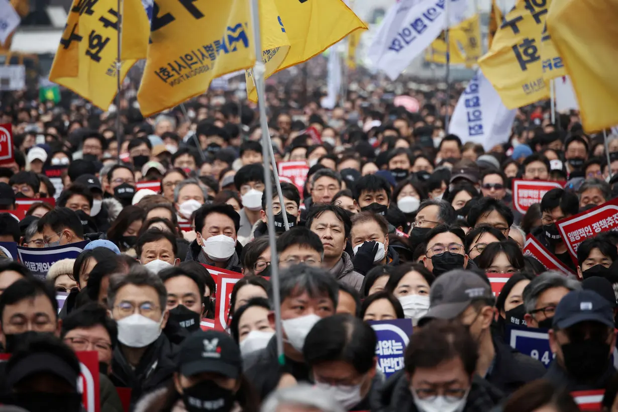 FILE PHOTO: South Korean doctors take part in mass rally against govt medical policy
