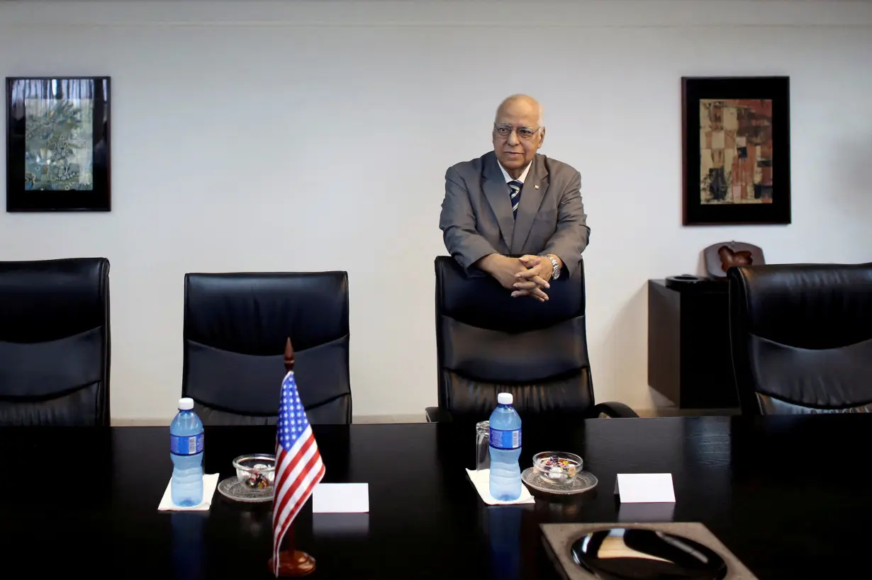 FILE PHOTO: Vice President of Cuba's Council of Ministers Ricardo Cabrisas Ruiz waits for the arrival of Missouri Governor Jay Nixon for a meeting in Havana, Cuba