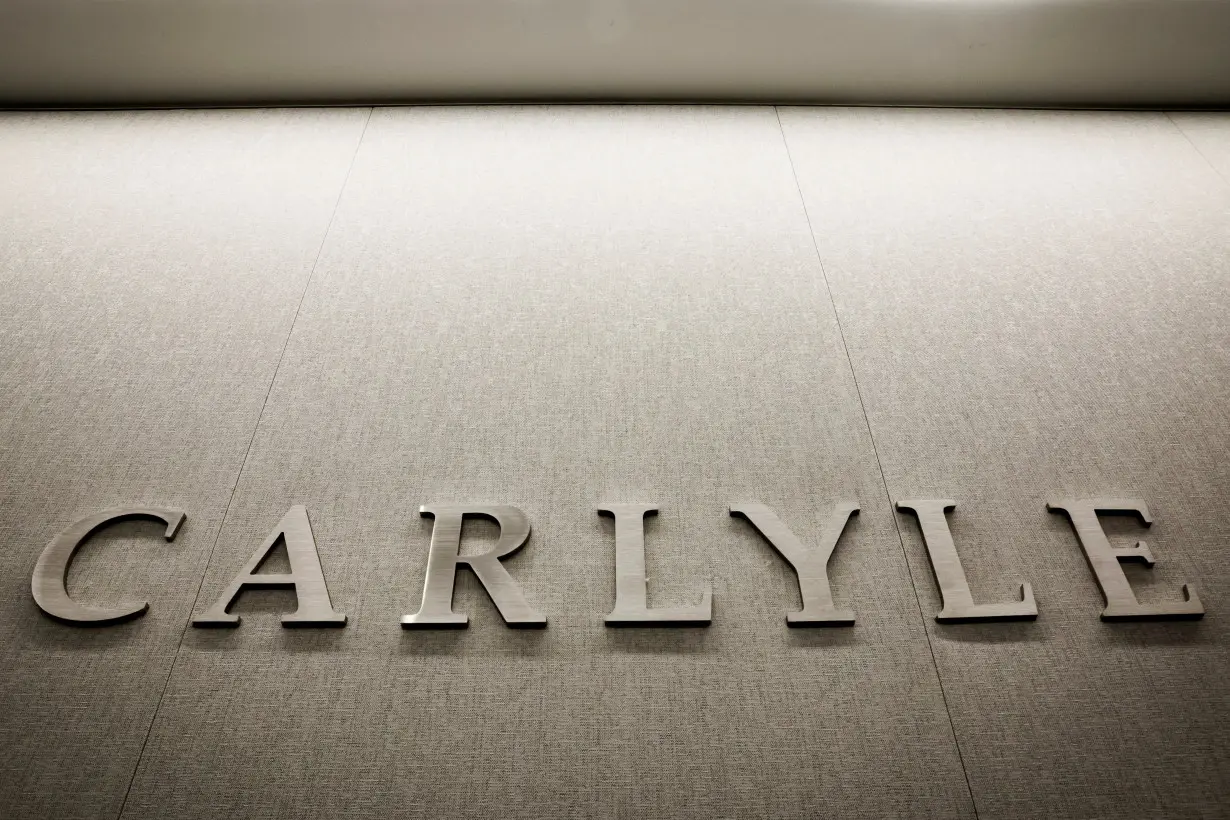 The logo for Carlyle is seen at the company’s offices in New York