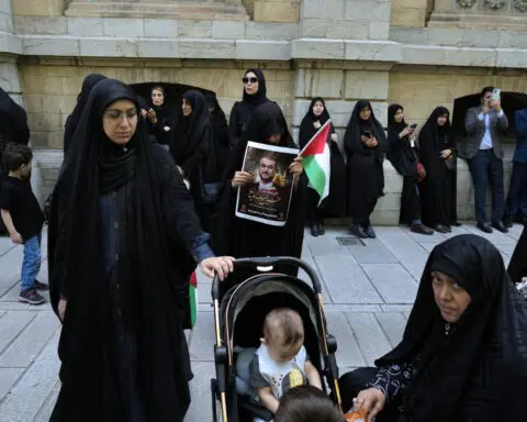 Iran inters its late president at holiest Shiite site in nation after fatal helicopter crash