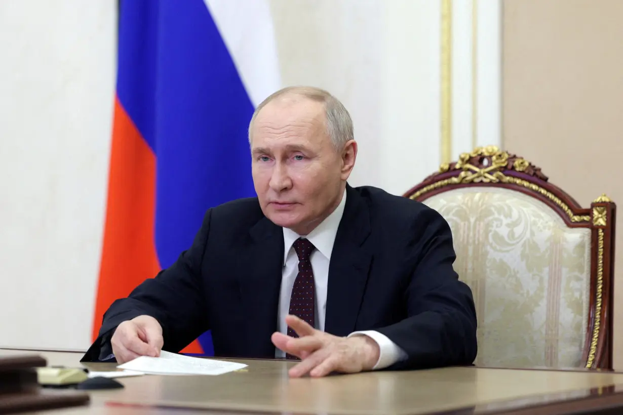 FILE PHOTO: Russian President Putin chairs a meeting on economic issues via video link in Moscow
